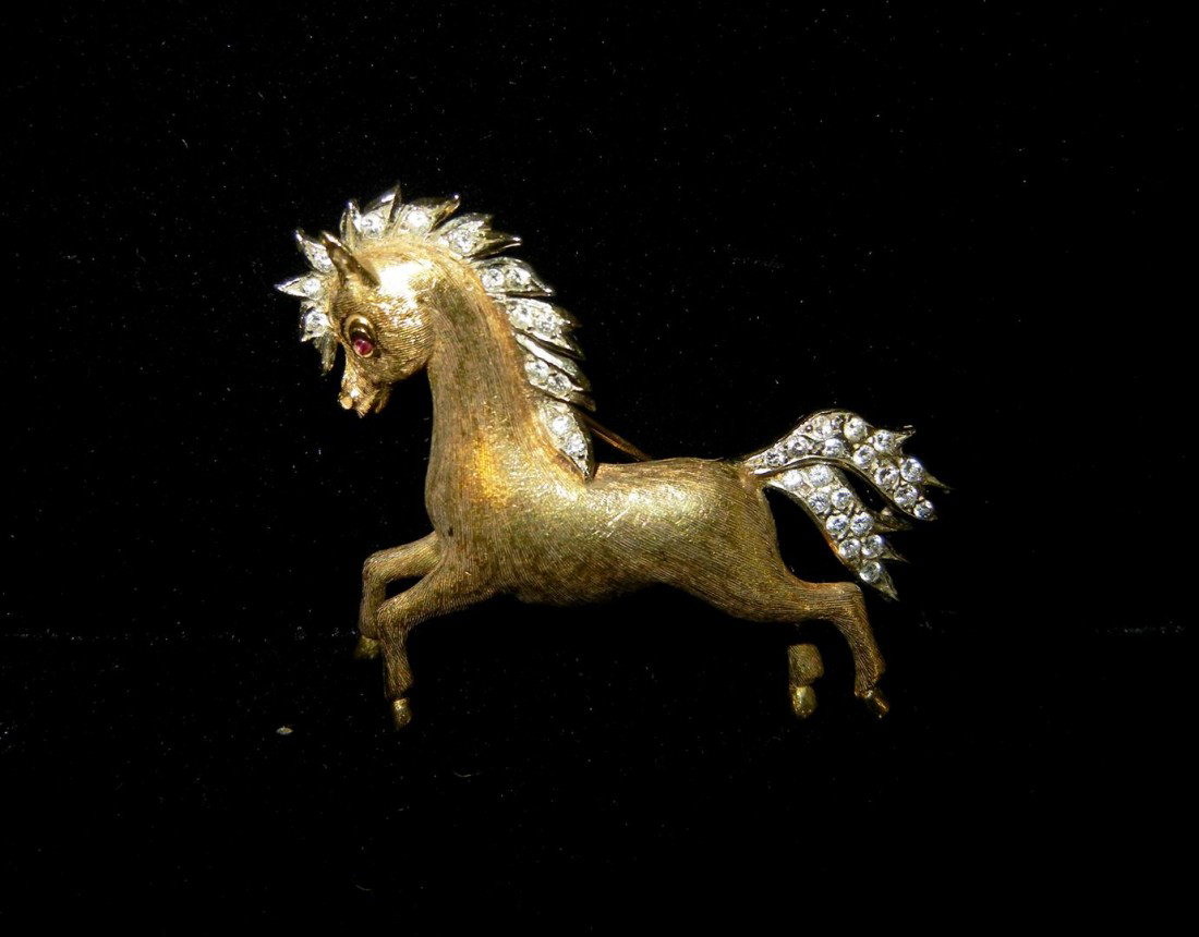 18KYG/WG & Diamond Horse Pin: The pin is bead set in white gold on the mane and tail with approximately thirty-three round full cut diamonds with a total estimated diamond weight of 0.29 carats. Diamond clarity: VVS-VS, average co