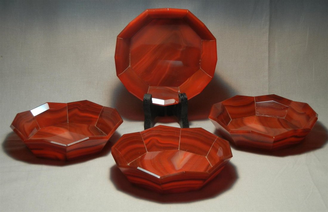 20thc. Carnelian Glass Dishes: 20th century four carnelian glass dishes with shaped and paneled sides. Dishes measure 4 3/4" in diameter.