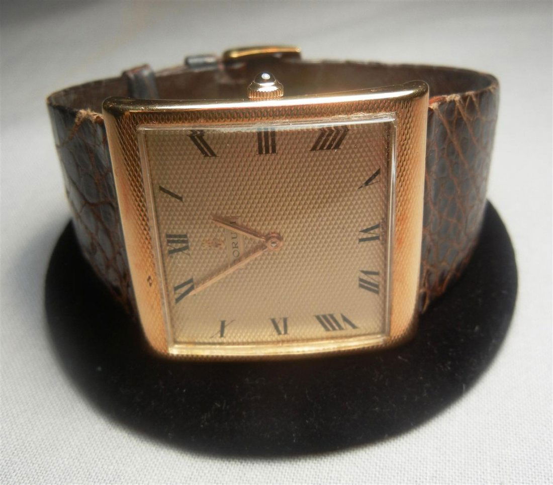 18K Corum Gent's "Buckingham" Watch: 18K gold Corum gent's "Buckingham" wristwatch with brown skin strap.