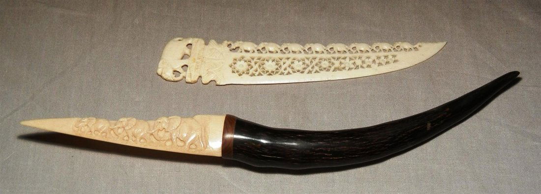 Ivory & Horn Letter Openers: In this lot are two ivory letter openers with carved elephants. One intricately carved ivory letter opener measuring 6 1/2" long. One ivory and horn letter opener measuring 11" long.