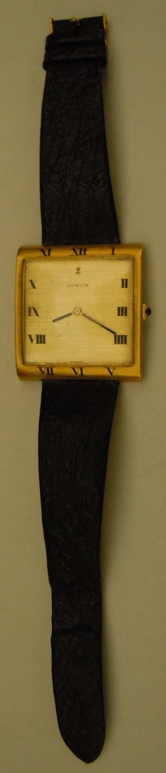 18K Corum Gent's "Buckingham" Watch: 18K gold Corum gent's "Buckingham" wristwatch with black leather strap.