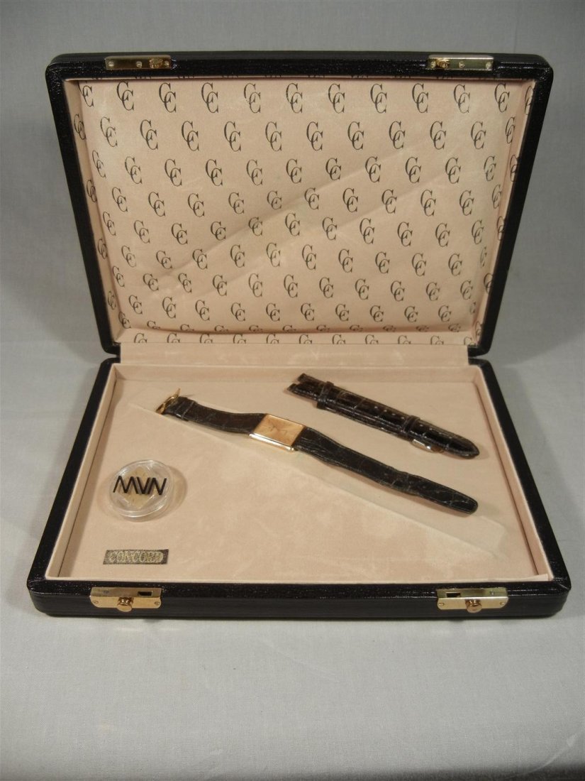 18KYG Concord Gent's Quartz Watch: 18KYG Concord gents quartz watch in original box with extra band and face.