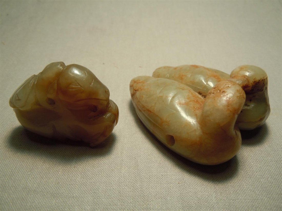Double Duck Chinese Jade Toggles: Two Chinese jade toggles. One toggle is of small beast and the other toggle is two ducks with their heads together.