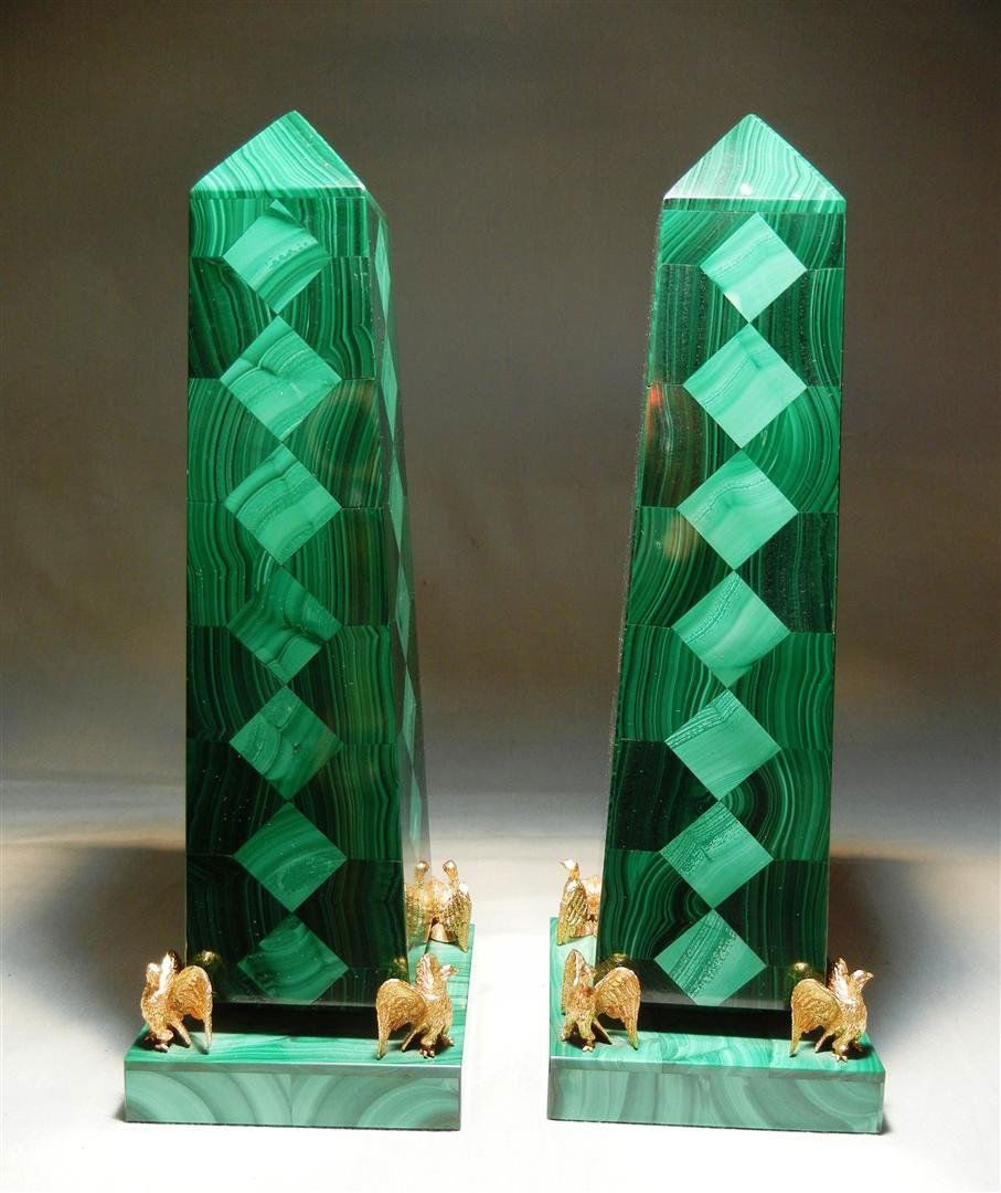 Pair of Russian Malachite Obelisks: Pair of 20thc. Russian malachite obelisks mounted on lucite step black plinth base. Corners are mounted with brass winged eagle. Obelisks measure 10 1/2"H.
