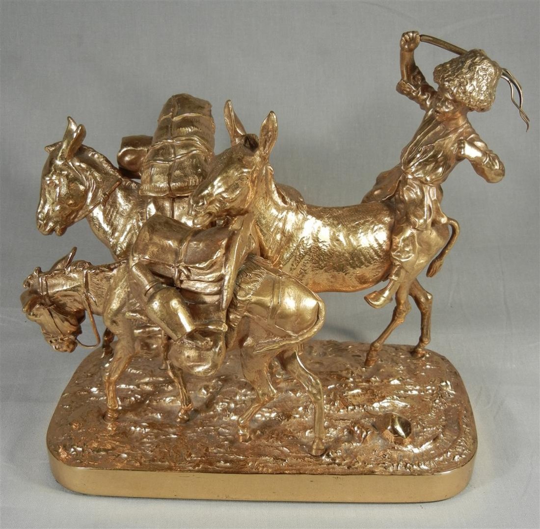 E. Aleksandrovich Lansere Russian Bronze: Dore bronze sculpture of three donkeys with rider by Russian artist E. Aleksandrovich Lansere. Sculpture measures 8" x 8 3/4" x 4 1/2."