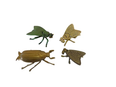 Four small "bug" match strikers