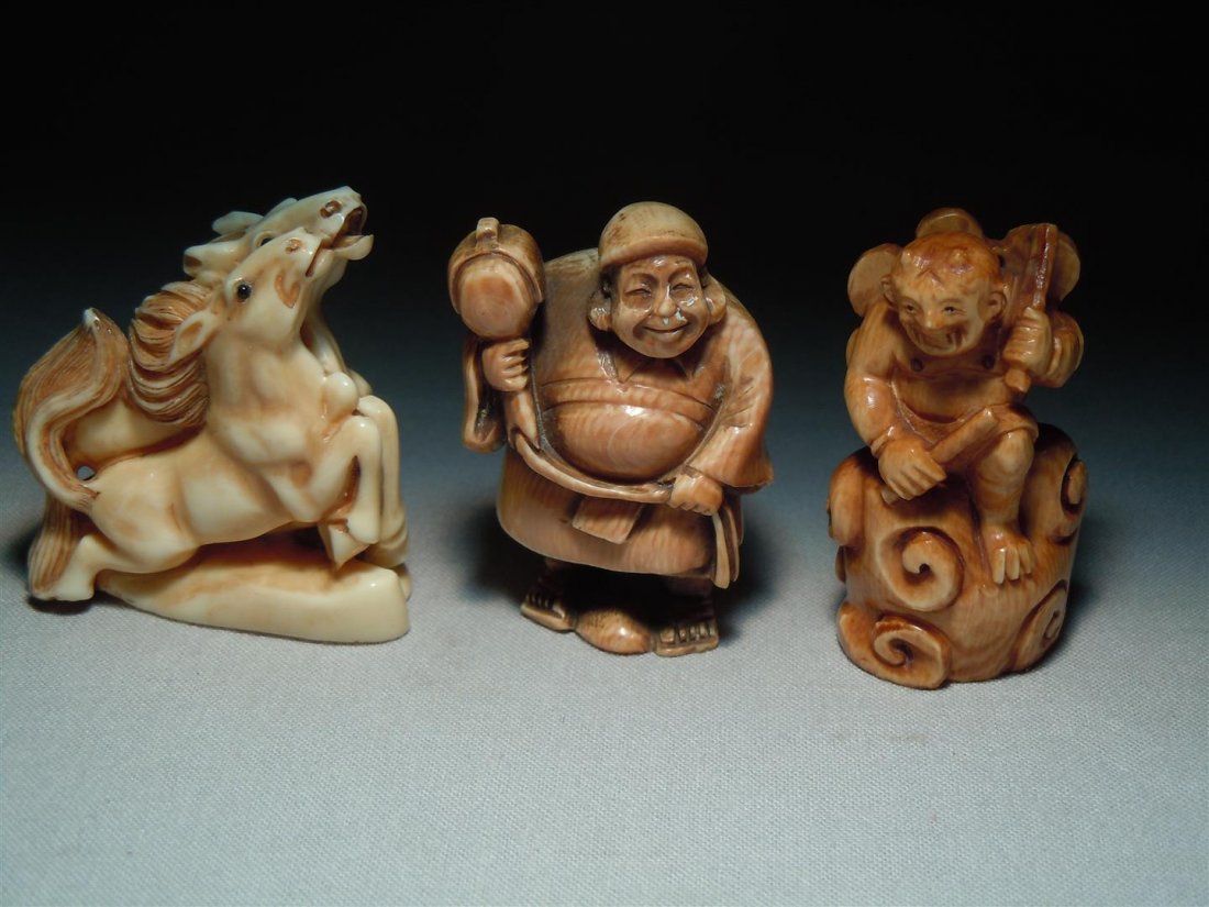 Three Japanese Ivory Netsukes: Three Japanese ivory netsukes. The horse netsuke and the man standing on a swirled base are signed. The all measure approx. 2"H.