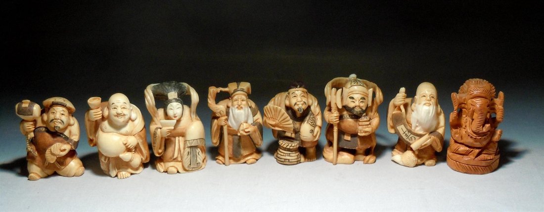Group of Japanese Ivory Netsukes: Group of seven Japanese ivory netsukes and one boxwood figure. Only one of the ivory netsukes appears to be signed (see photo). The netsukes measure approx. 2"H.