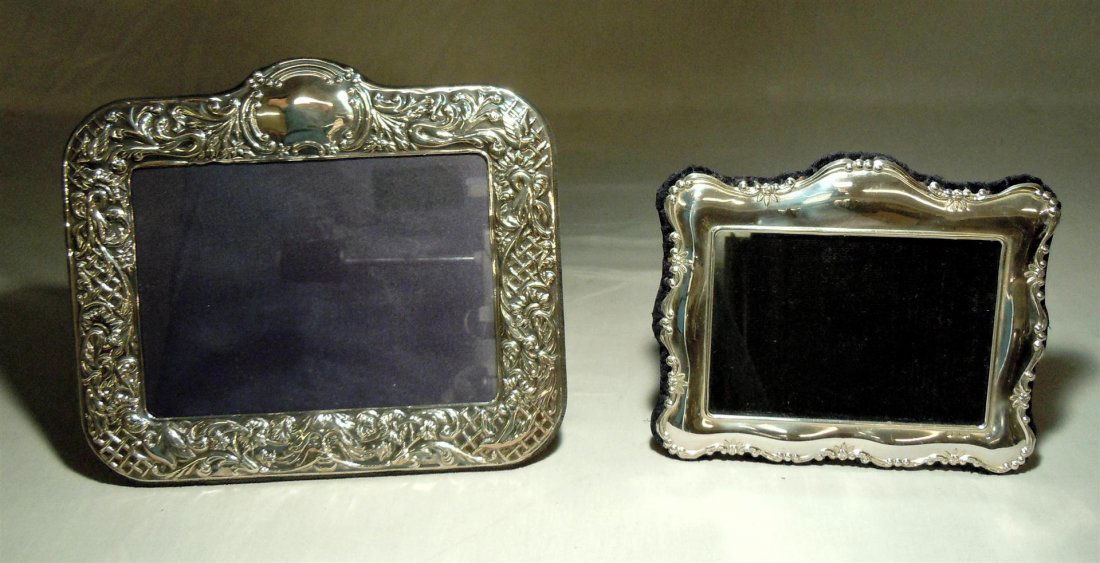 Two Sterling Silver Picture Frames: Two sterling silver picture frames. Frame on left measures 8 1/2" x 9 3/4" and the frame on the right measures 6 1/2" x 7 1/2." Maker's mark and hallmarks shown in photos.