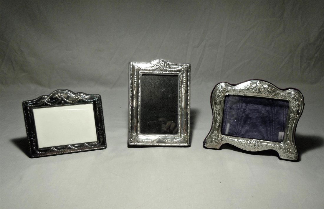 Three Sterling Silver Picture Frames: Three sterling silver picture frames (measurements from left to right in photo). First frame measures 5 1/2" x 6 1/4." Second frame measures 8" x 5 1/2." Third frame measures 6" x 7 1/4." Maker's mark