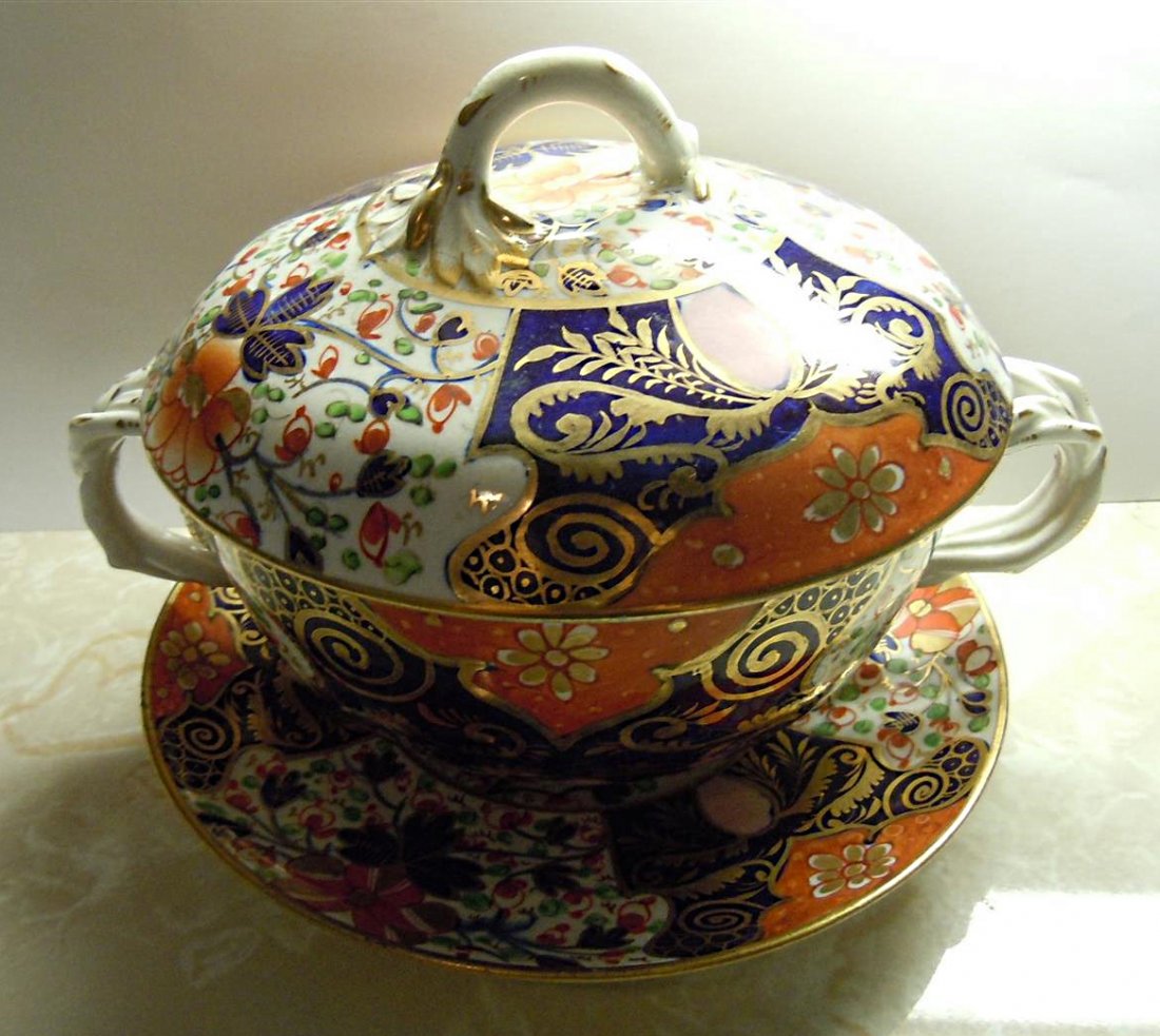 Derby Covered Casserole: Crown Derby covered casserole on Imari Pattern with under plate measuring 5 1/2" x 8" Pair of matching small tureens in next lot.