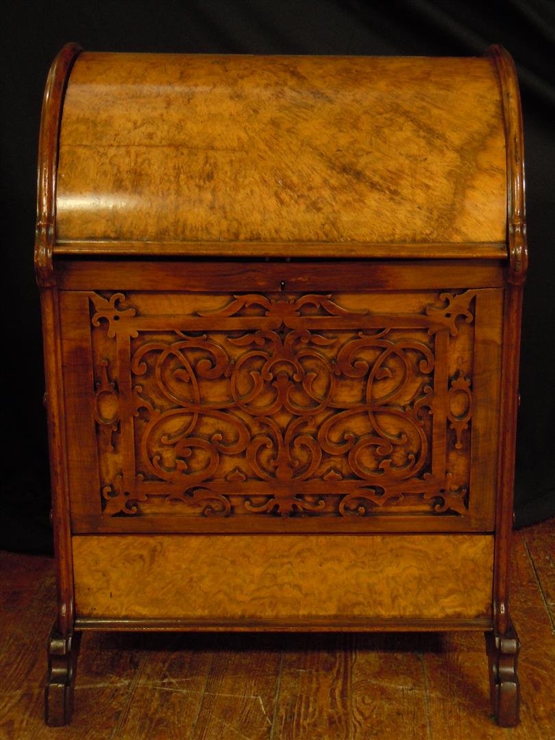 Intricately Carved Victorian Walnut English Canterbury: A well-carved walnut Victorian English canterbury measuring 27 1/2" x 19" x 18."