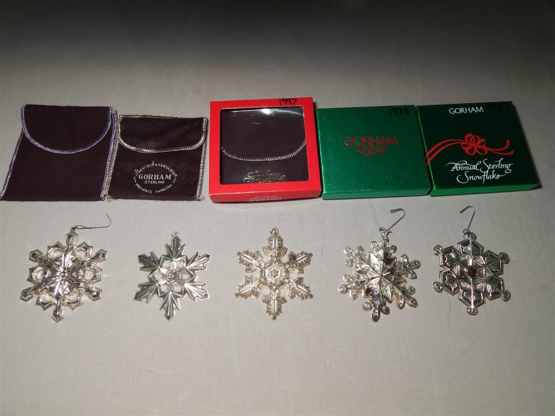 Gorham Sterling Silver Snowflake Ornaments: Five sterling silver Gorham snowflake Christmas ornaments from the 70s, 80s and 90s. All ornaments are marked "Gorham Sterling" (see photos).