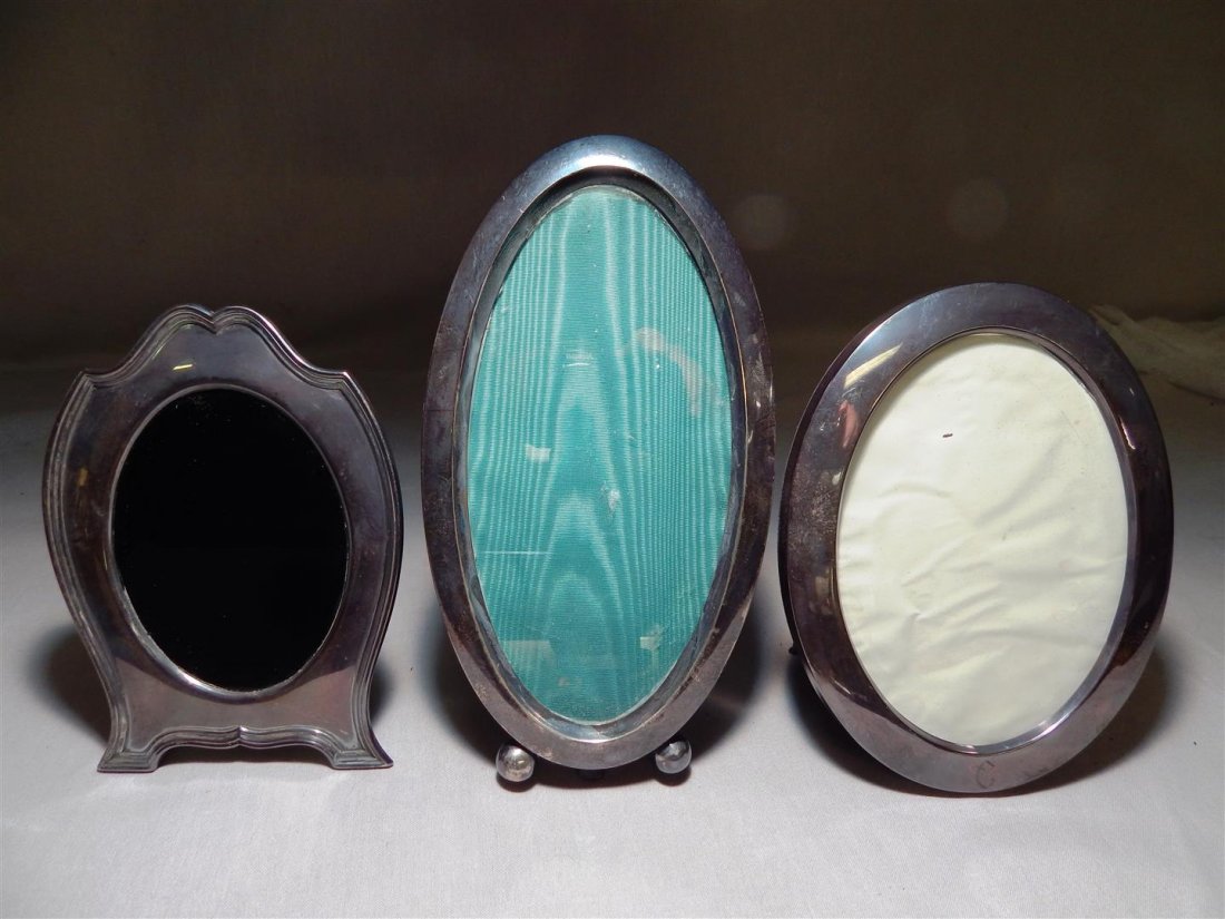 Three Sterling Silver Picture Frames: One "Webster" sterling picture frame measuring. One "Reed & Barton" sterling picture frame measuring. One frame is marked, "sterling" and measures