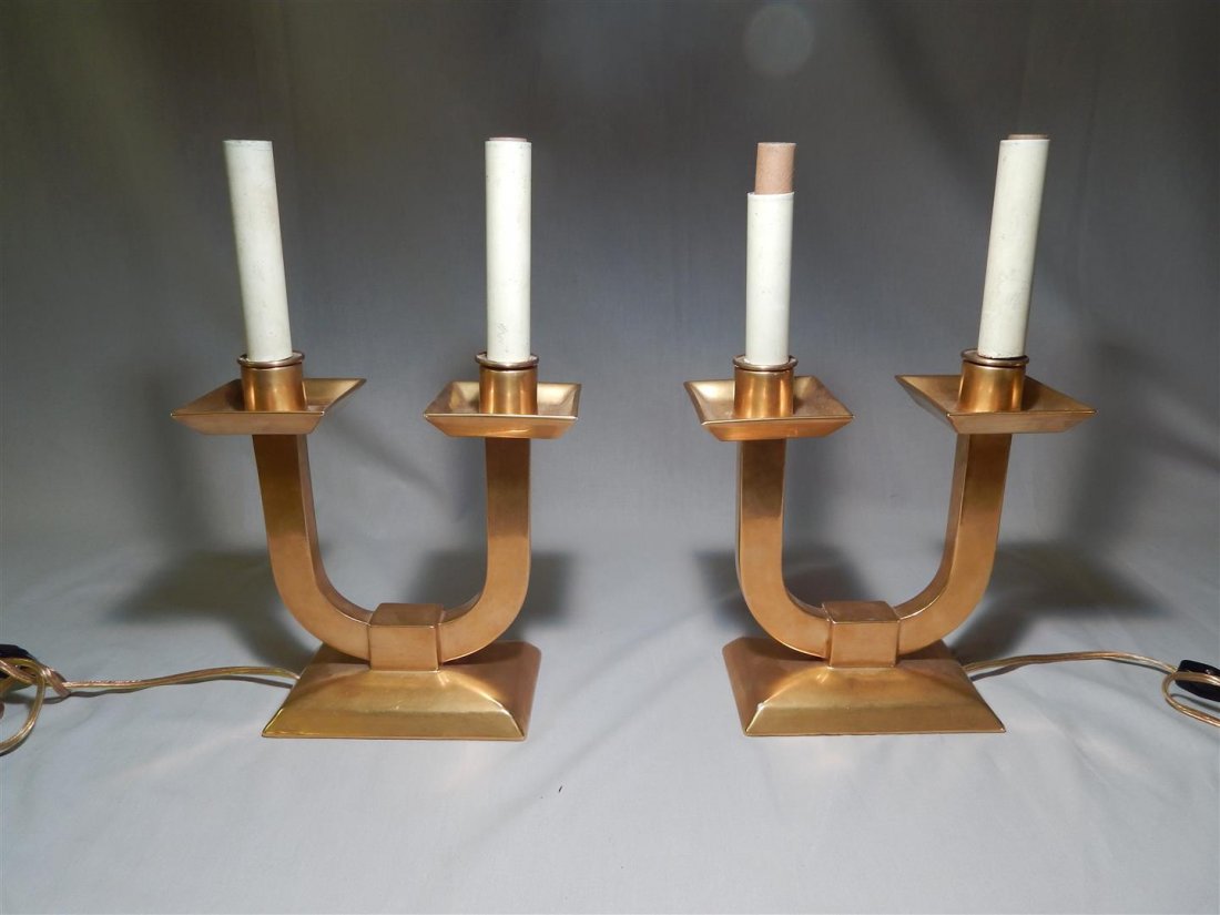 Pair Jean Luce French Art Deco Ceramic Candelabra: A pair of "U" form gilt ceramic two light candelabra designed by Jean Luce, French Art Deco ceramicist and glassware designer (1895 - 1964). Each stamped "Jean Luce Paris France" on undersides. The ca