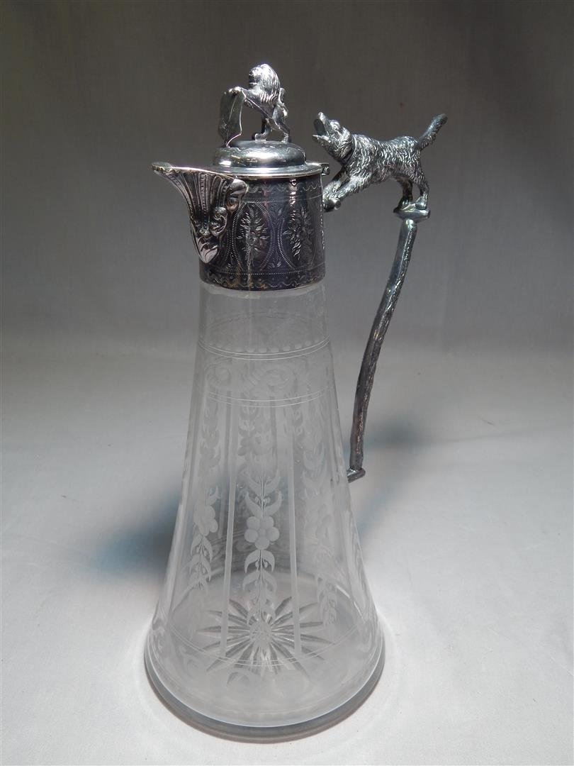 Silver-Plated & Crystal Victorian Ewer: Silver-plated and crystal Victorian ewer with animal handle and finial (see photos). The ewer measures 11 1/2"H.