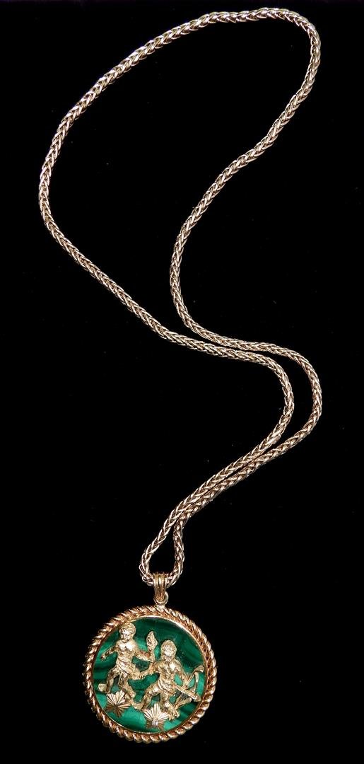 Van Cleef & Arpels Malachite Gold Gemini Pendant: One of the zodiac Van Cleef & Arpels line of pendants. Total gross weight 90.3 dwt. The piece is marked, "16V243 VCA @ 18K"