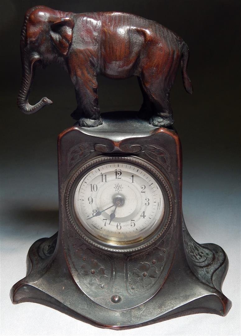German Figural Bronze Clock: A german figural bronze clock with an elephant on top. Measures 7".