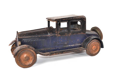 Dayton Friction Toy Works No. 500 Coupe Deluxe Pressed Steel Car: Old and tough to find toy car that tuns 100! This antique is Number 500 and the Coupe Deluxe at 19" long. Toy was made circa 1924. Original condition toy with replacement spare. Good. It is