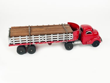 Large Hubley Stake Tractor Trailer and Log Load Diecast 1950s