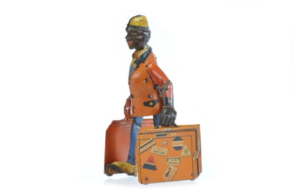 Distler Traveler Man with Luggage, Unusual Black Variation Tin