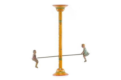 Gibbs Mfg. Co. Flip Over Tin Hand Painted Boy & Girl on Teeter Totter Toy