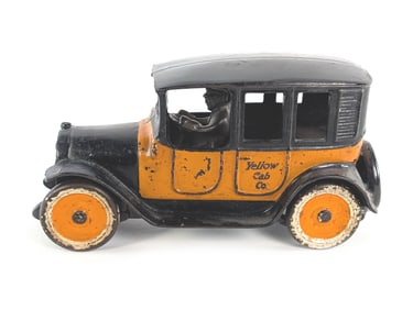 Large Arcade Cast Iron Yellow Cab w/Metal Tires & Driver