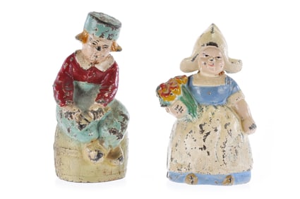 Hubley Dutch Boy on Carrel and Dutch Girl Holding Flowers Still Bank Set of 2