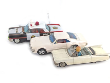 Group of 3 Tin Litho Japanese Friction & Batt. Op. Toronado, Police Car & Cadillac Convertible