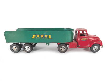 1950's Pressed Steel Tonka Toys Steel Carrier Semi Truck Tractor Trailer: This pressed steel cab and trailer have scratches and rubs in the paint. The tires are rubber, and the hubs are intact. The decals and bumper are intact. It is approximately 23.25" long.