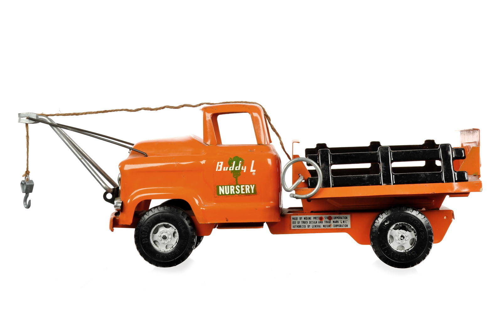 1950s Buddy L Nursery GMC Stake Truck: This is a pressed steel 1950s Buddy L Nursery GMC stake truck. It is in very good condition and measures approximately 18" L.