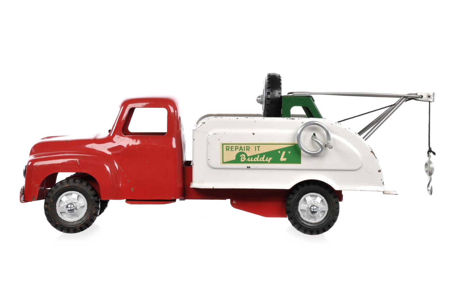 Buddy L Repair It Wrecker Tow Truck: This is a Buddy L Repair-It wrecker tow truck. It comes with an extra tire. It measures approximately 16.25" L.