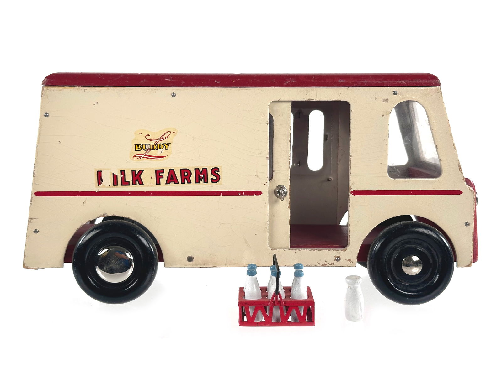 Buddy L Wood Milk Farms Delivery Truck w/Milk Carrier: This is a Buddy L wooden Milk Farms delivery truck with milk carrier. It is in very good shape and measures approximately 13" L.