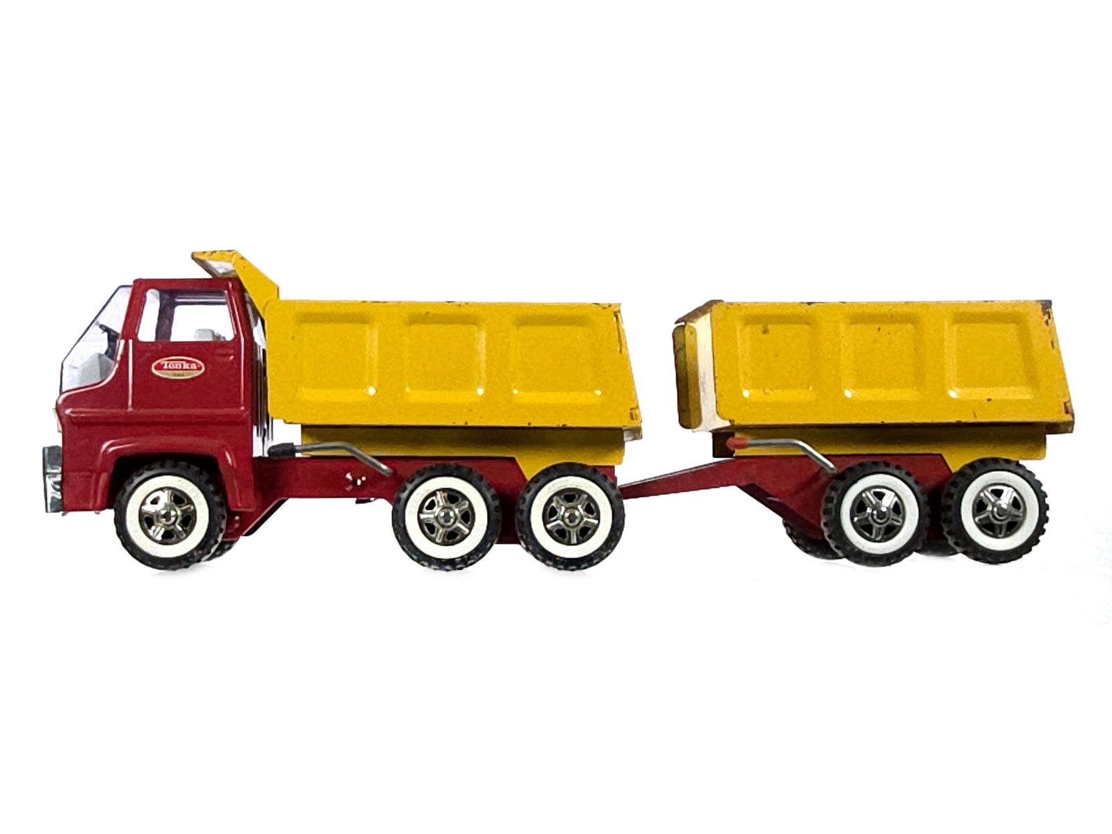 Tonka Pressed Steel Dump Truck and Dump Trailer: This is a Tonka pressed steel dump truck with dump trailer. Both measure approximately 12" L.