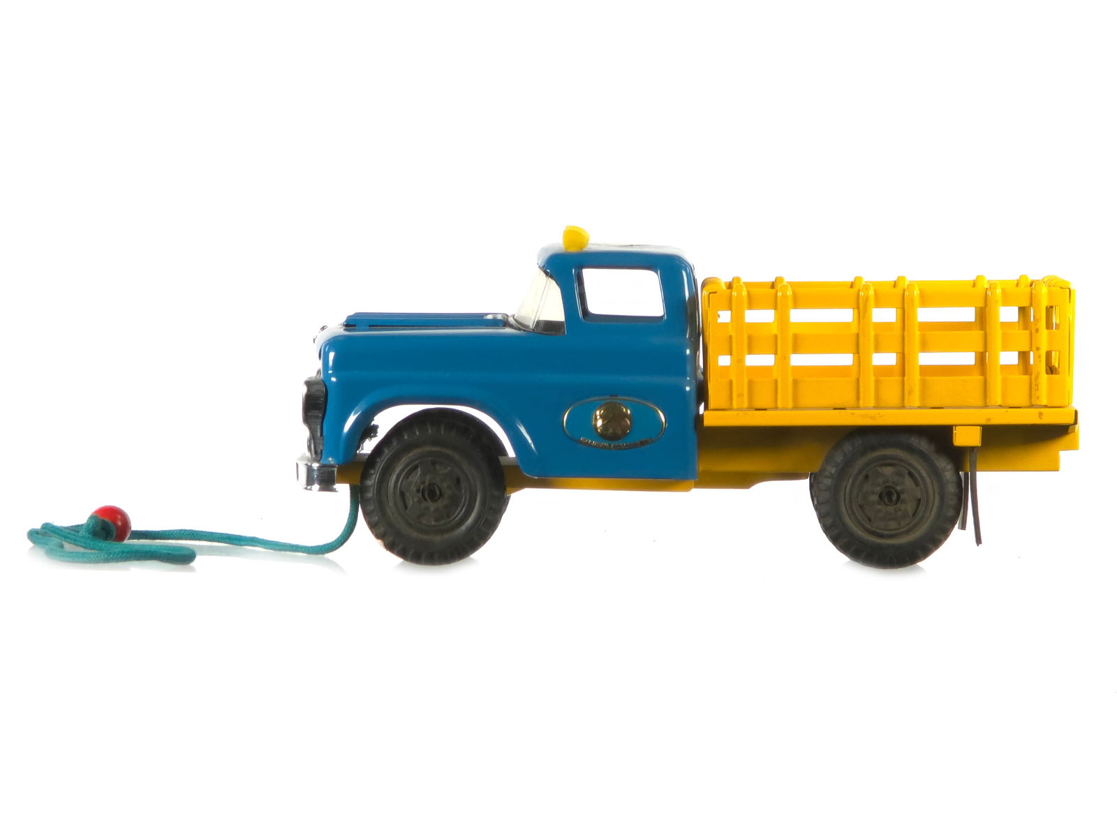 Marusan Pressed Steel Stake Truck Pull Toy Japan: This is a Marusan No. 599 pressed steel stake truck pull toy from Japan. It measures approximately 12" L.
