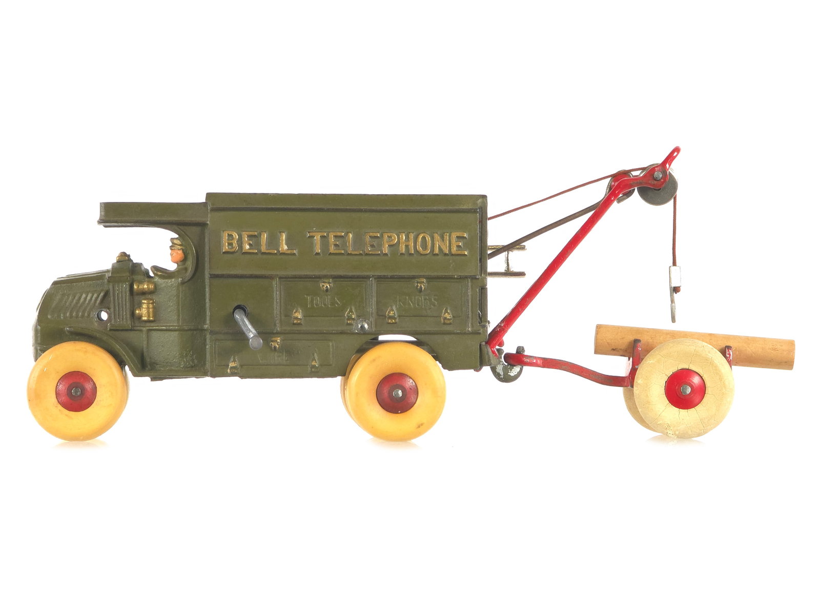 Hubley Cast Iron Bell Telephone Truck 10": Olive Bell Telephone truck with cast-in driver and rubber wheels. The wheels on the truck have been replaced. The winch and right rear handrails are repaired. Accessories are included as shown with ni