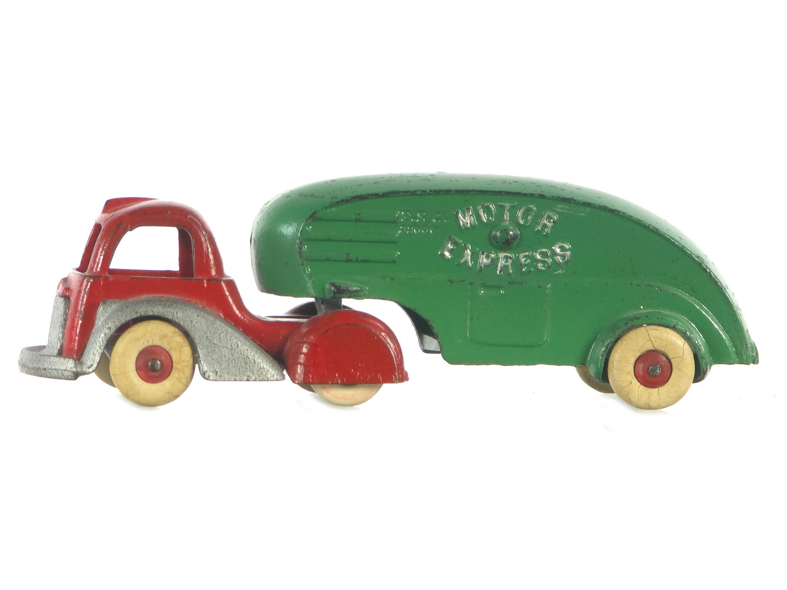 Hubley Motor Express Moving Van Cast Iron: Original Streamline Motor Express tractor trailer. Outstanding example of this circa 1940 streamline toy. Paint appears all original. Two tires under fairings are likely replaced, but visible tires ar