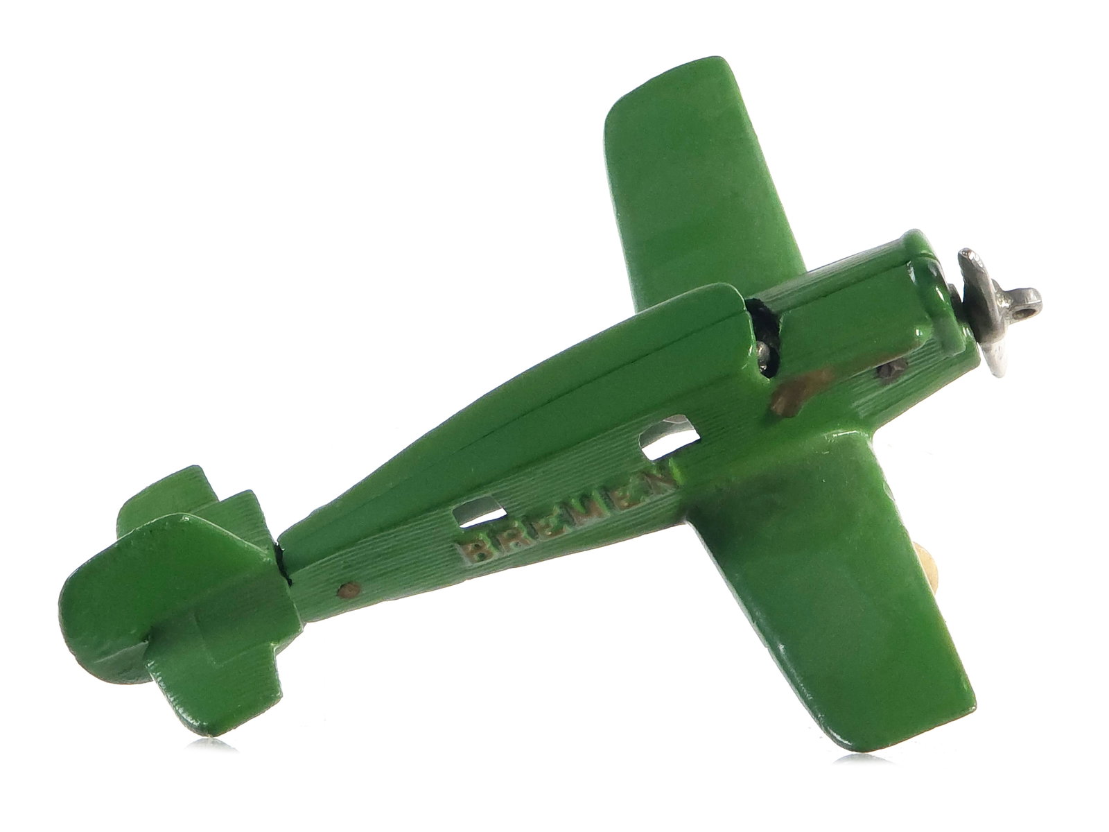 Hubley Bremen Propeller Plane Cast Iron: Green Hubley cast iron Bremen plane. The toy appears to have an incredible paint restoration that is barely perceptible. Tires appear proper and are old rubber. Gloss and gold highlights are immaculat