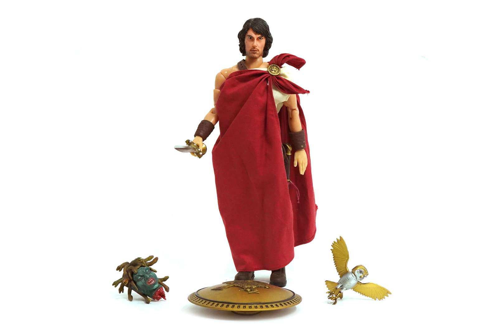 NECA Clash of the Titans Perseus 12.5": NECA Clash of the Titans Perseus action figure. Accessories include shield, sword, and owl named Bubo. Measures approximately 12.5" tall.