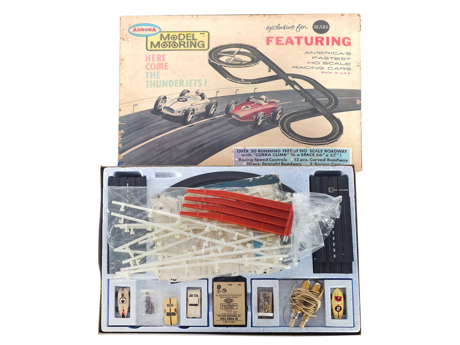 Sears Aurora Model Motoring HO Scale Slot Car Racing Set Boxed: Sears Exclusive Aurora Model Motoring Stirling Moss Table Top Racing Set in the original box featuring America’s fastest HO scale racing cars. It includes over 20 running feet of HO scale roadway
