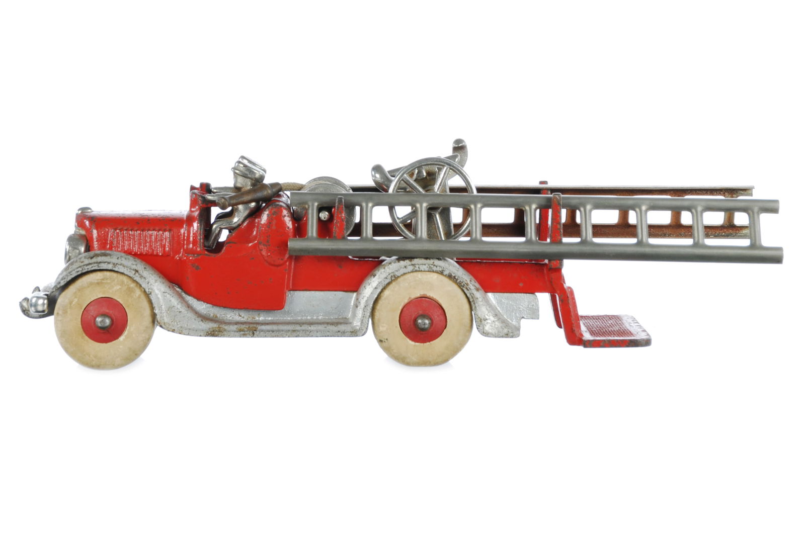 Rare Hubley Diamond T Fire Truck Cast Iron: A very rare Hubley Diamond T fire truck with a hose reel. This difficult-to-find variation retains proper ladders, hose, and reel, and remains in excellent original condition. It measures approximatel