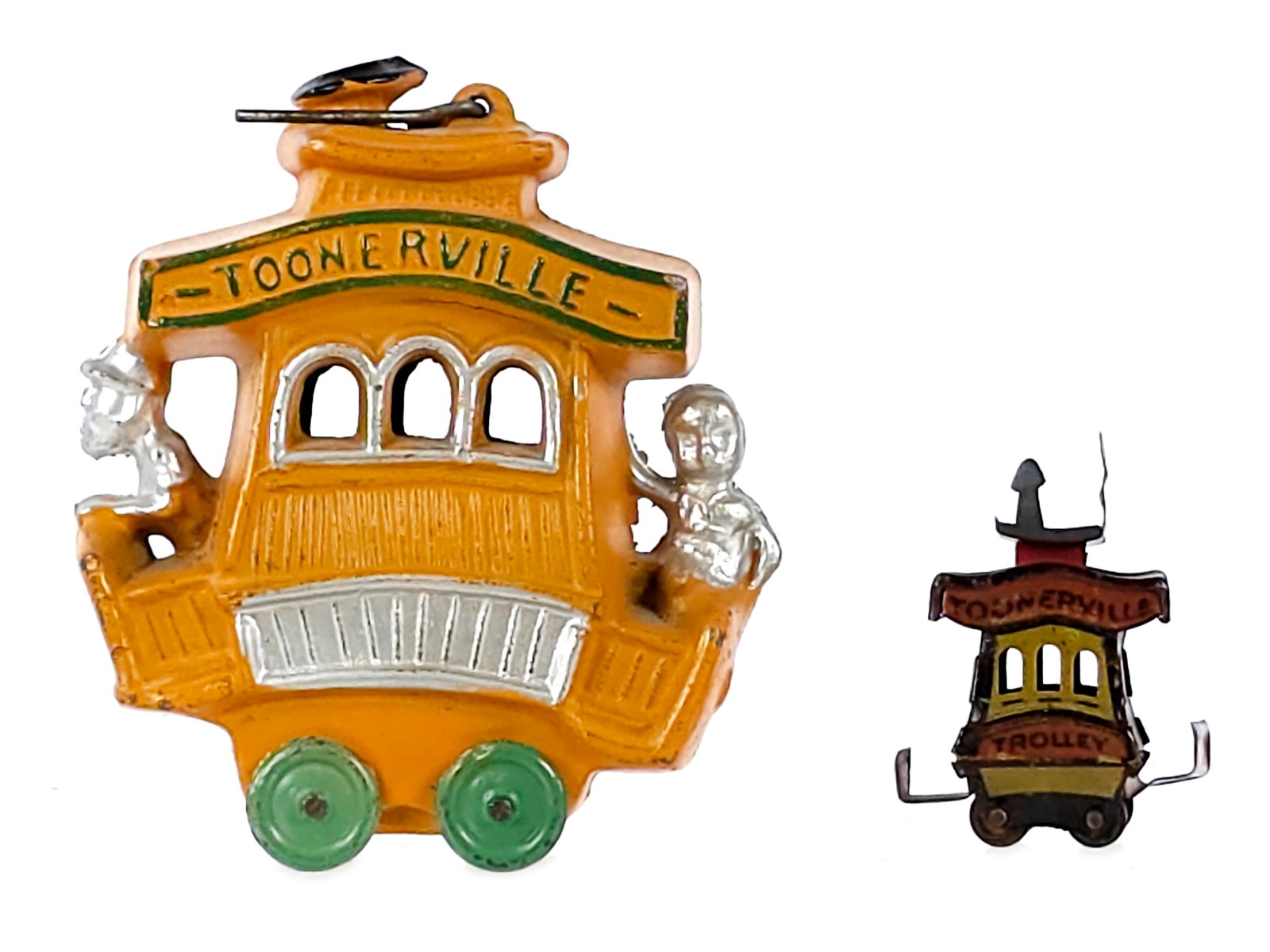 (2) Toonerville Trolley Dent Lead & Cracker Jack Tin Toys: A great set of Twin Toonerville Trolley toys. The first is an orange lead trolley by Dent in immaculate original condition. It measures approximately 3" L. The second is a tin Toonerville trolley