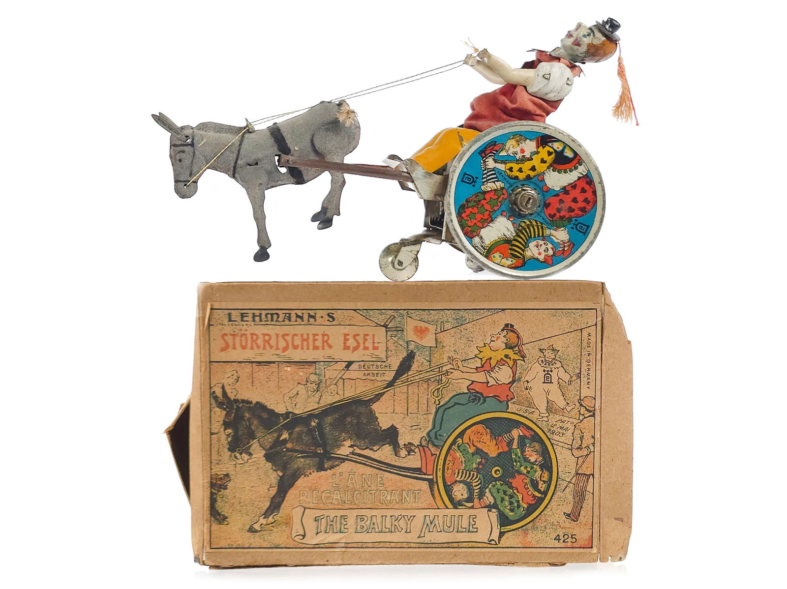 Lehmann's #425 Storrischer Esel: The Balky Mule Boxed: This is a tin lithographed windup No. 425 Storrischer Esel “The Balky Mule” clown and donkey cart manufactured by the Ernst Lehmann Co. of Brandenburg, Germany. When wound with its dedicated k
