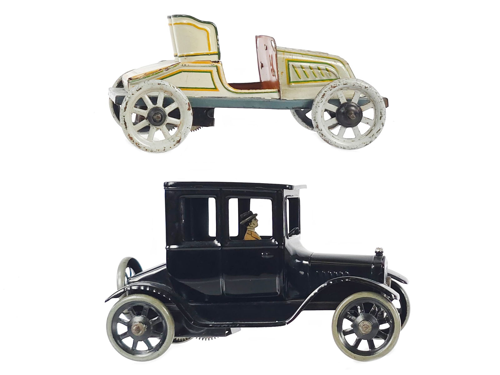 (2) Bing Ford Model T & Convertible Open Racer: A set of two Bing windup tin cars including a tin windup Ford sedan measuring approximately 6.5" L and a convertible open racer measuring approximately 5.5" L. Both are all original, and we tested