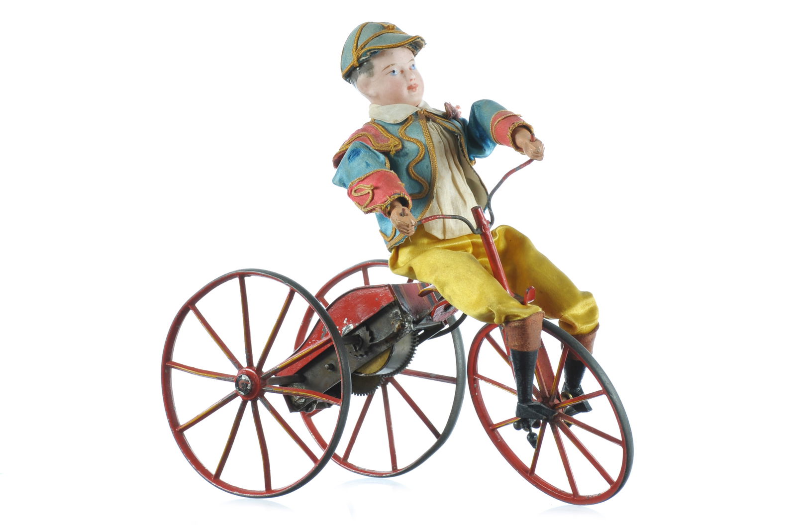 French Vichy ca. 1865 Bisque Head Boy on Tricycle Windup: Rare French, early ca. 1865 Gustave Vichy bisque head boy with closed mouth, wooden arms and legs, seated on a cast metal tricycle with large spoked wheels and original red and black stenciled paint.
