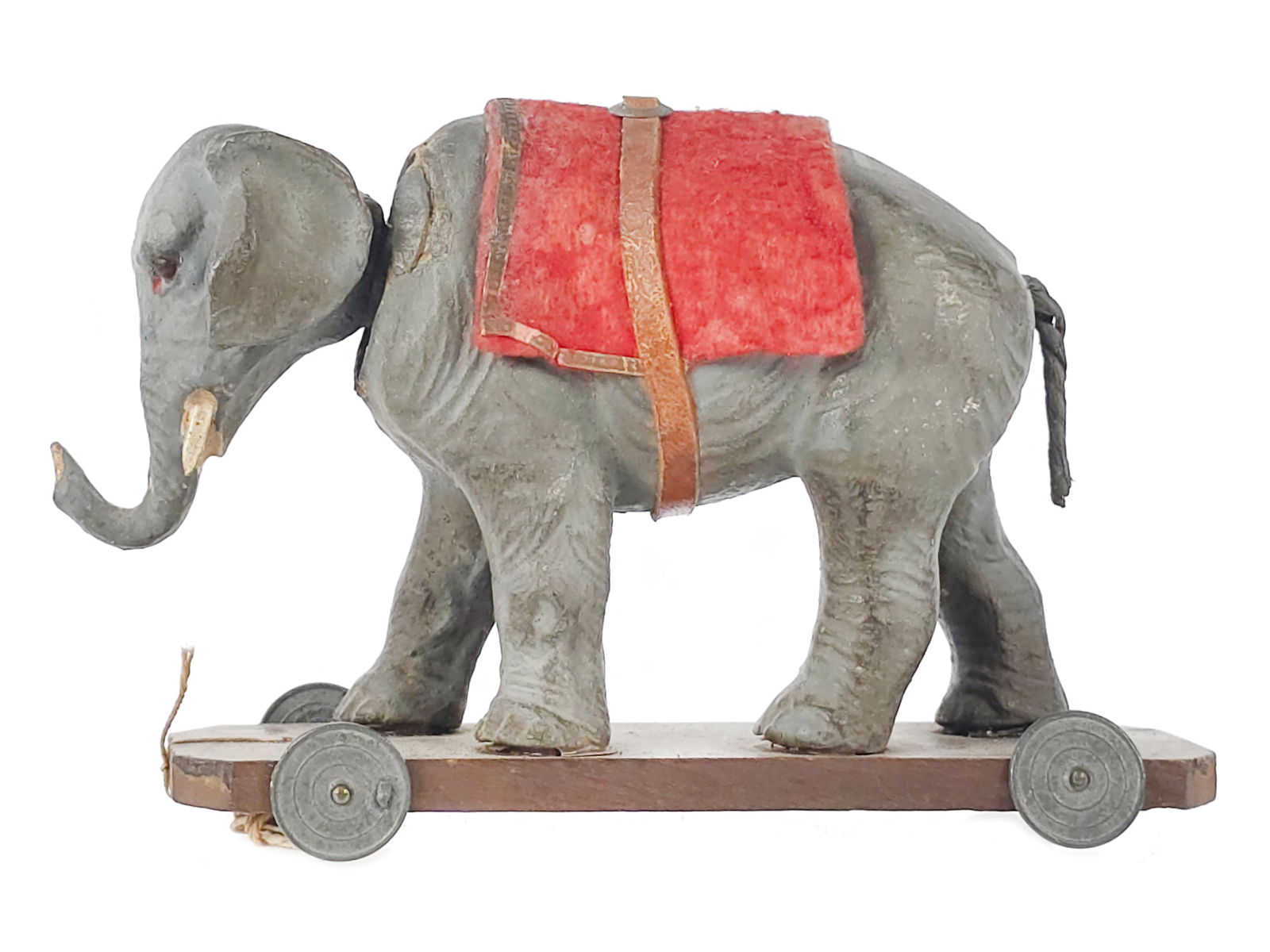 Composite Elephant on Platform Head Nodder Pull Toy: A great little composite elephant head nodder pull toy on platform with highly detailed wrinkles molded into the composite material. It measures approximately 5" L.