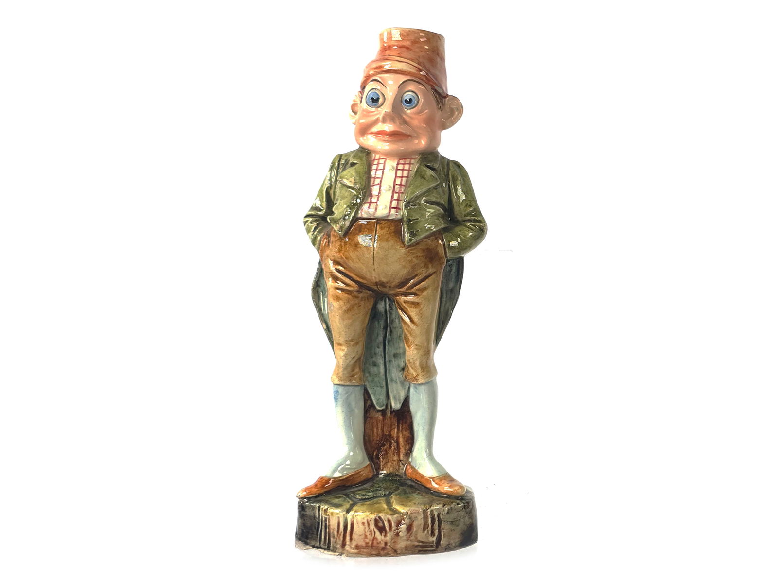 Majolica Palmer Cox Brownie Irish Gentleman Candlestick: This antique Majolica pottery Palmer Cox "Brownie" Irish Gentleman character figurine candlestick holder features a stump-like base and depicts the Irish Gentleman from the Palmer Cox Brownie