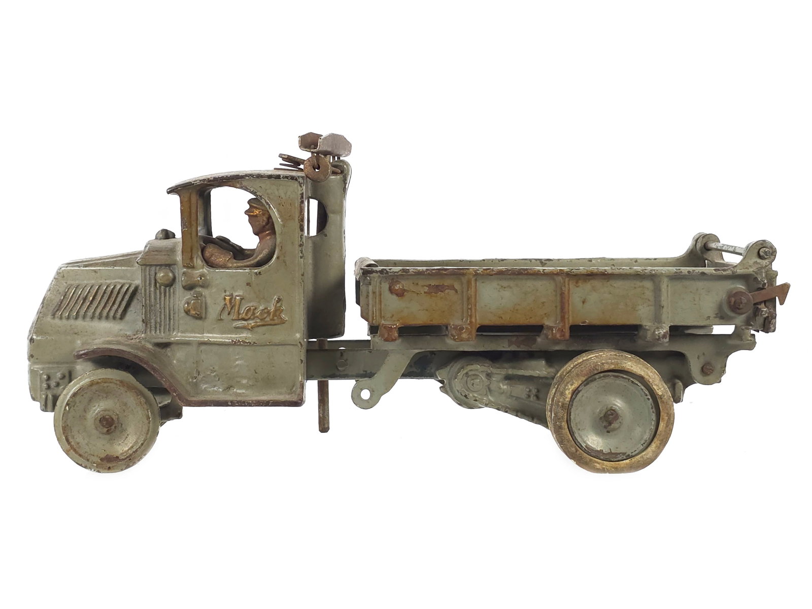 Arcade Toys Large Grey Mack Cast Iron Truck: Large scale Arcade Toys dump truck, circa 1925, retaining original paint with nice gold highlights and proper dump bed. The piston will raise the dump bed if the string is replaced. A nicely plated dr