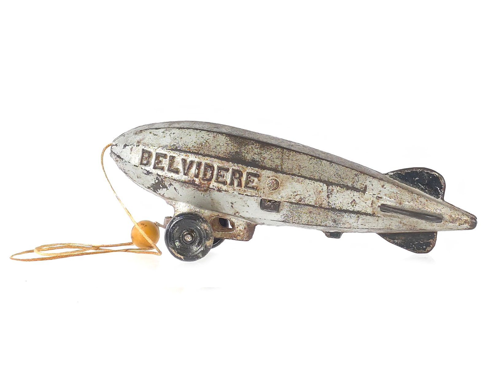 Coveted Vindex Belvidere Blimp Zeppelin Cast Iron: Incredibly scarce Vindex Belvidere cast iron zeppelin, also known as a blimp. The toy retains original silver paint with black fin highlights and is one of the only examples we have seen surface from