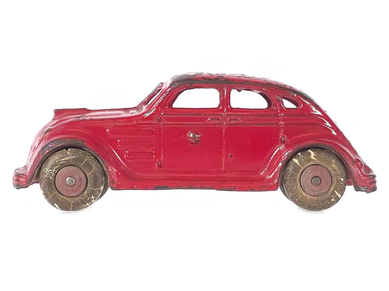 Large Scale A.C. Williams Chrysler Airflow Cast Iron: Large-scale and lesser-seen A.C. Williams Airflow in red. The toy retains original paint and original wheels and represents a desirable larger 6.5" L example of this streamlined design.